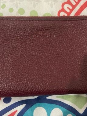 Coach Pebbled Leather Wristlet in Wine
